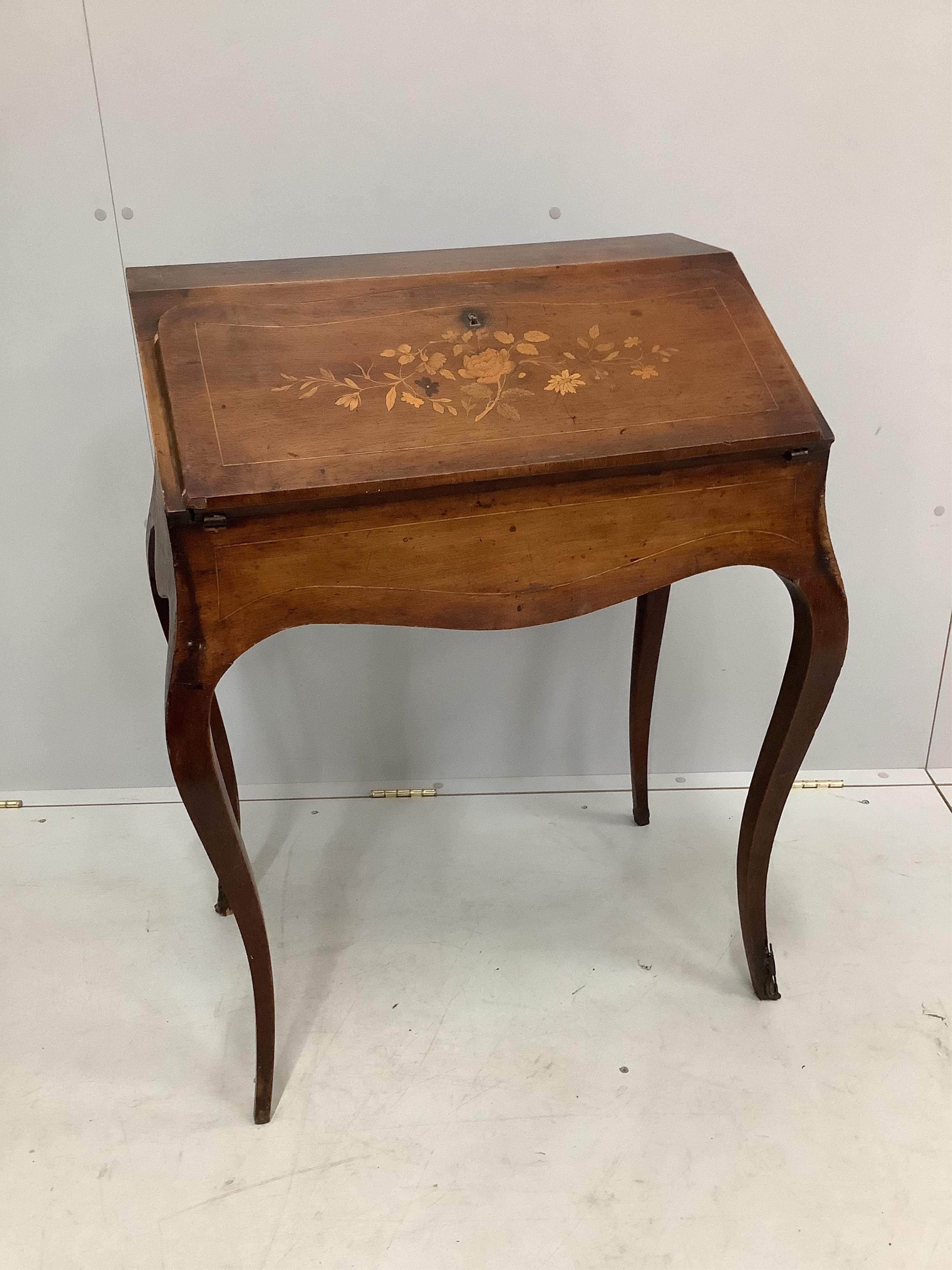 A Louis XV style floral marquetry inlaid bureau de dame, width 65cm, depth 43cm, height 89cm. Condition - fair